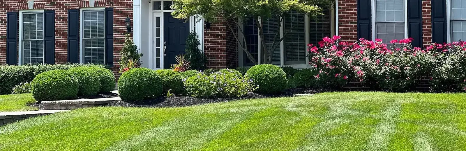 brick home with nice yard